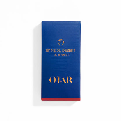 Blue OJAR perfume box labelled as 'Epine Du Desert Eau De Parfum' with gold text on a white background