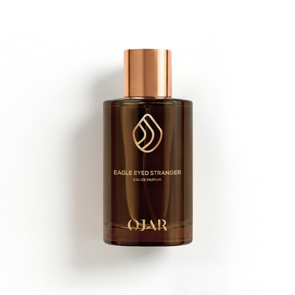 Brown perfume bottle with copper cap on a white background. OJAR EAGLE EYED STRANGER 100ML EAU DE PARFUM