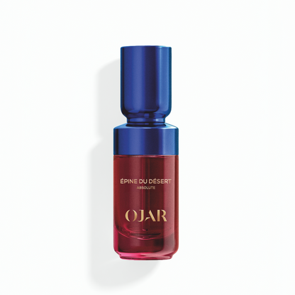 Absolute Perfume Oil bottle in 20ml by OJAR with blue cap and red body labelled as 'Epine du Desert' on a white background