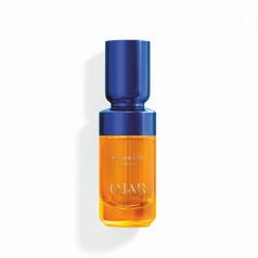Absolute Perfume Oil bottle in 20ml by OJAR labelled as 'Halwa Kiss' with blue cap and orange liquid on a white background
