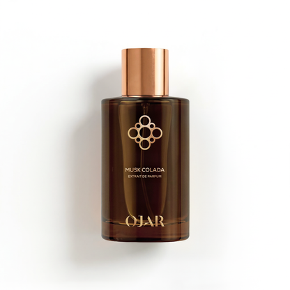 Brown perfume bottle from OJAR named Musk Colada in 100ml Extrait de Parfum with copper cap on a white background