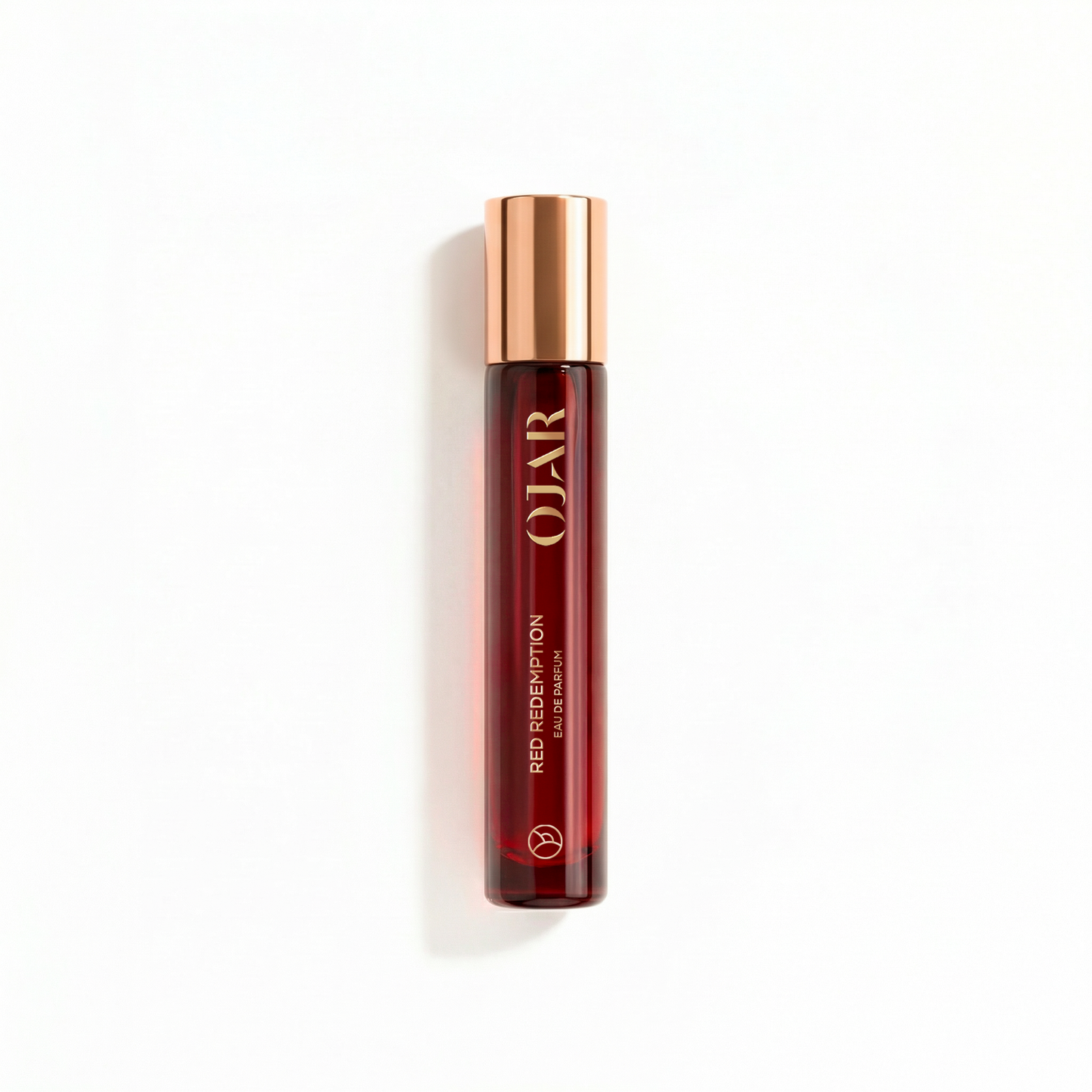 OJAR RED_REDEMPTION_ EDP 15ML IN A RED BOTTLE WITH A BRONZE CAP AGAINST A WHITE BACKGROUND