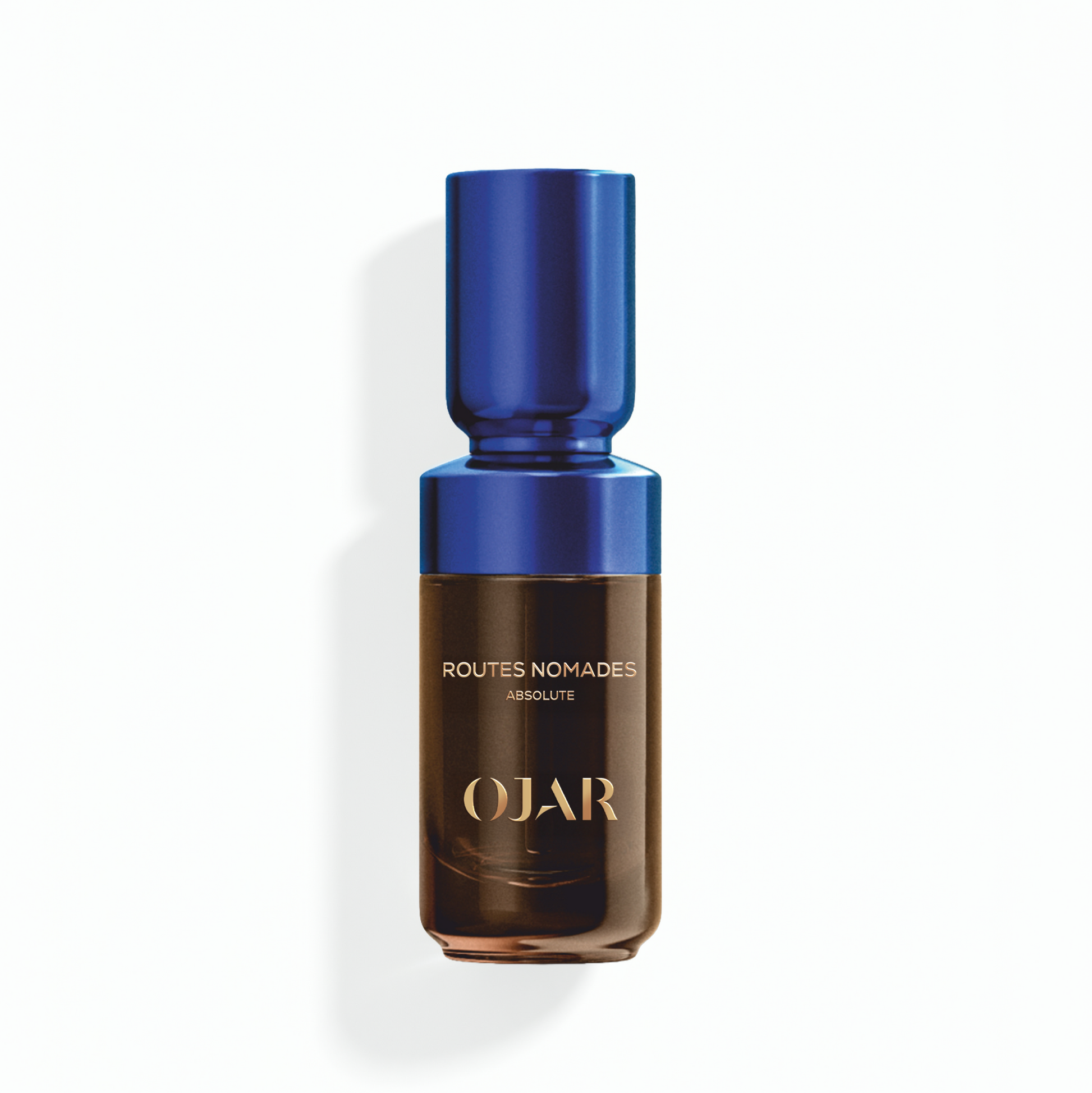 OJAR ROUTES_NOMADES Absolute Oil 20ml Perfume bottle with blue cap and brown body on a white background