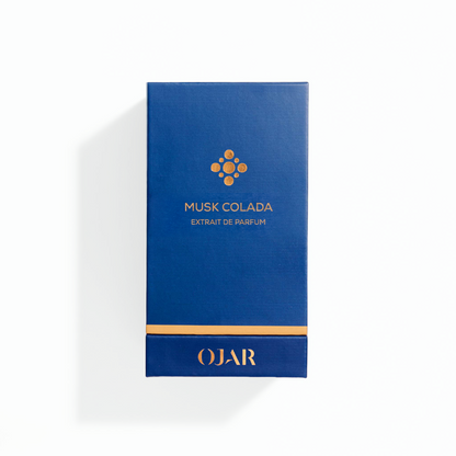 Blue box of OJAR Musk Colada perfume extract on a white background